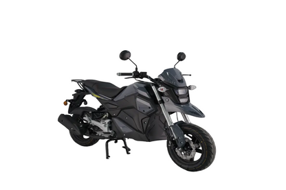 A modern gray sport motorcycle with black components, shown on a reflective concrete surface with a soft, misty studio background.