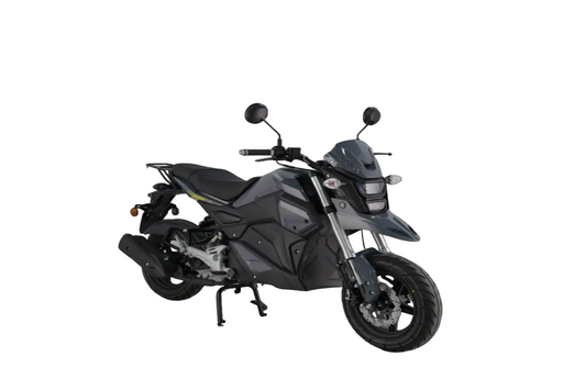 A modern gray sport motorcycle with black components, shown on a reflective concrete surface with a soft, misty studio background.